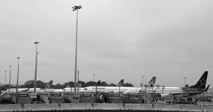 MONTREAL QUEBEC CANADA 06 02 2020:  Air Transat aircraft are parked at the runway of Montreal Dorval  Airport with turbines sealed for a longer rest as a result of the corona pandemic.