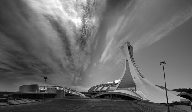 MONTREAL QUEBEC CANADA: Montreal Olympic Stadium tower and olympic rings and cauldron. It's the tallest inclined tower in the world.Tour Olympique stands 175 meters tall and at a 45-degree