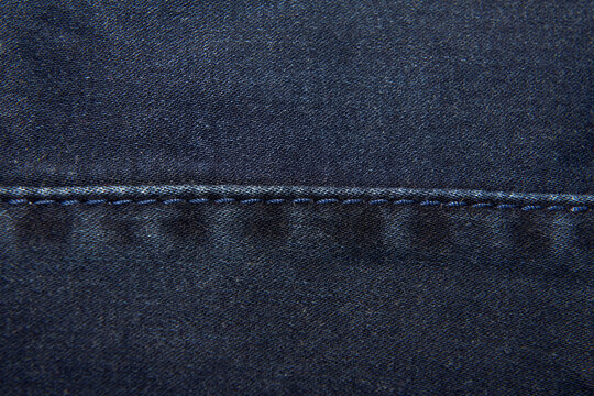 Dark blue denim background close-up