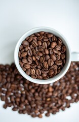 Naklejka premium coffee beans in a cup