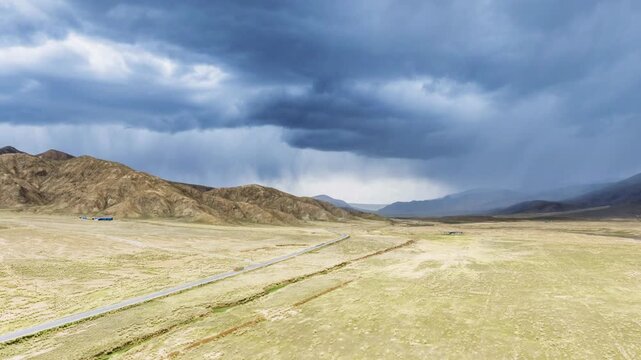 Aerial Time-lapse of Approaching Thunderstorm Over Highland Highway with Rain Virga  