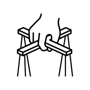 Hand breaking a wooden chair.