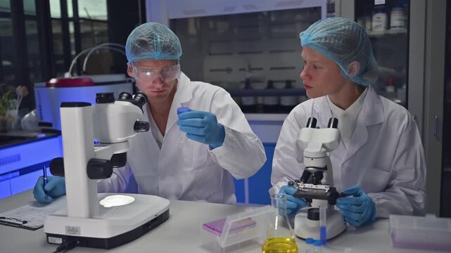 Professional Biology Team Inspect Liquid Vial Sample In Medical Laboratory
