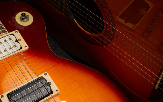 Musical abstract background colored with two guitars with texture