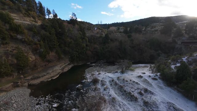Drone Aerial FPV Flying Below Historic Metal Truss Bridge Over Rio Percey in Trevelin Chubut Patagonia Argentina