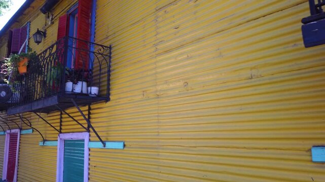 POV Closeup Yellow Corrugated Metal House Facade with Balconies in Caminito La Boca Buenos Aires city Argentina