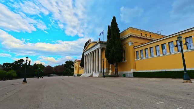 Zappeion hall with people at historical square street road in summer ancient city by National Gardens of Athens, Greece