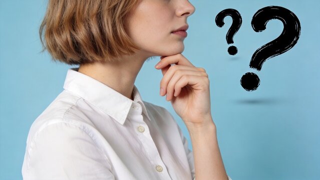 Young woman thinking with question marks, concept of doubt, confusion, decision making and problem solving, business or lifestyle portrait on blue background