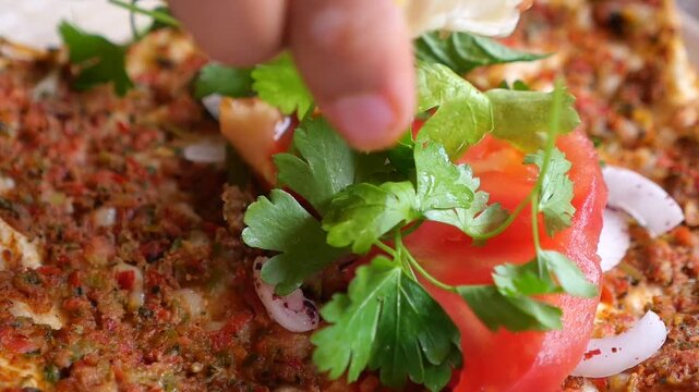 This dish is Lahmacun, a popular Turkish flatbread often referred to as Turkish pizza
