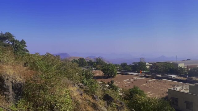 Scenic view from the Saptashrungi Gad funicular railway descending the hillside overlooking valleys mountains and settlements near Vani in Nashik Maharashtra India.