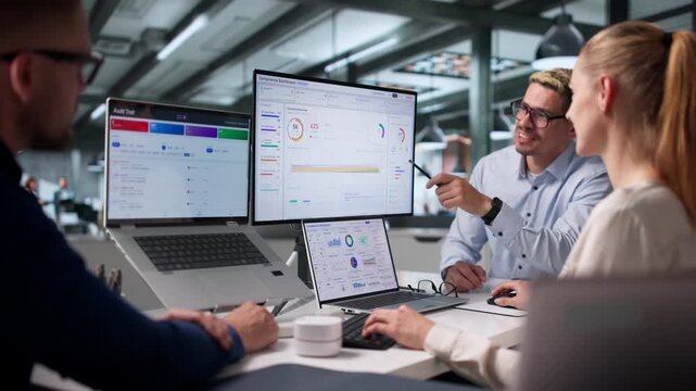 Compliance Officer Reviews Automated Risk Management Dashboard