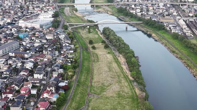 SHIBATA, JAPAN.Riverside sakura landscape April 28 2026