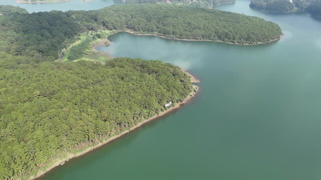 Drone Flight Over Pine Hills and Winding Lake Inlets on Tuyen Lam Lake in Da Lat, Vietnam