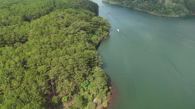 Telephoto Drone View Tracking Tourist Boats on Tuyen Lam Lake in Da Lat, Vietnam