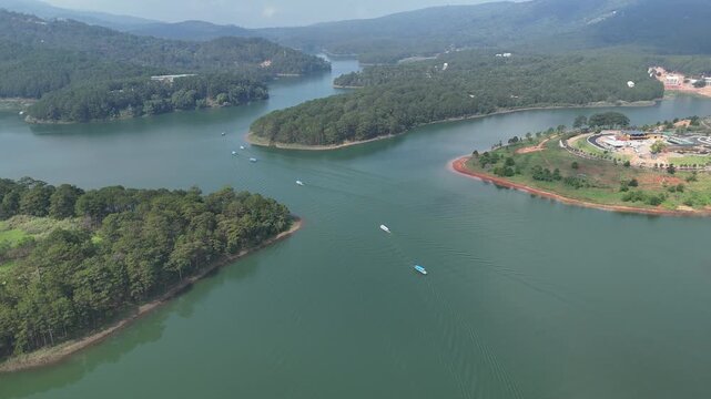 Oblique Aerial View of Tuyen Lam Lake With Tourist Boats and Lakeside Resort in Da Lat, Vietnam