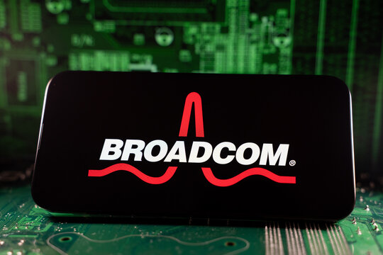 Close up of Broadcom logo on device with circuit board background. Toronto, Canada - June 11, 2026.