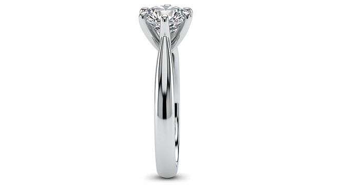 Side view of a classic solitaire engagement ring made from polished white metal on plain background