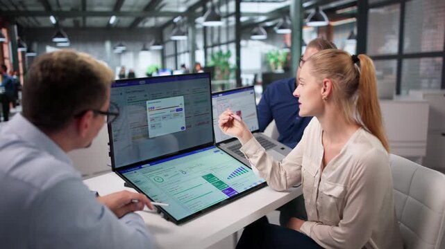Business Manager Leads Diverse Team Tracking Quarterly Company OKRs