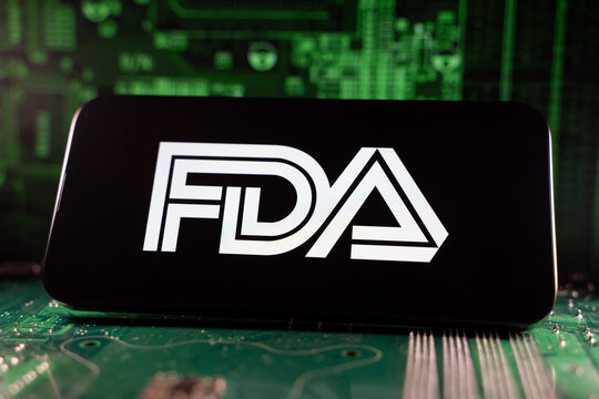 Close up of FDA logo on device with circuit board background. Toronto, Canada - June 11, 2026.