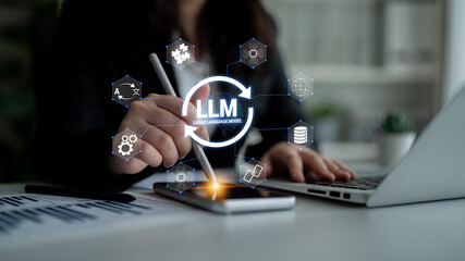 Business professional interacting with large language model technology on a smartphone with digital icons representing innovation and creativity in a modern workspace Quark. © InfiniteFlow