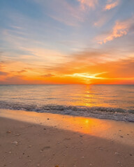 Fototapeta premium Golden Sunset Over Calm Tropical Beach with Gentle Ocean Waves