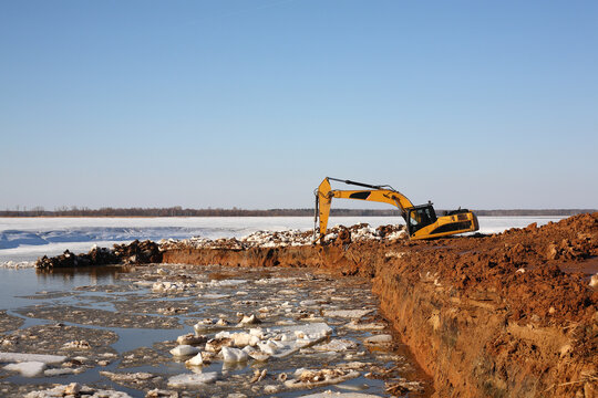 Construction - Orange Excavator work in dirt