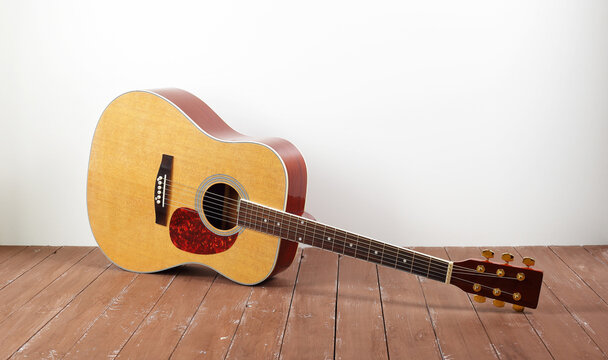 Musical instrument - acoustic guitar wood background