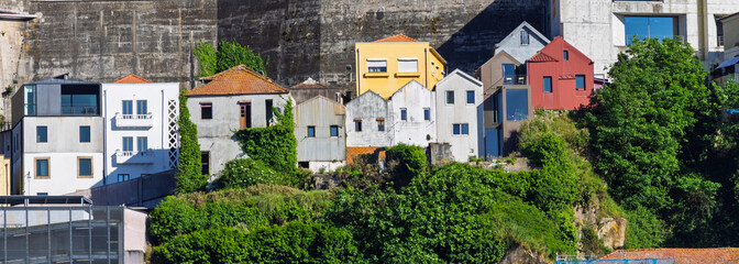 Naklejka premium Porto Ribeira colorful houses building hillside panorama