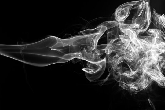 White smoke abstract shape swirling on a solid black background.