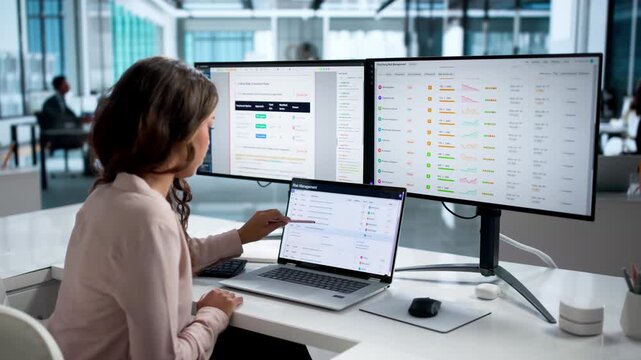 Risk Manager Carefully Analyzes Financial Data On Laptop