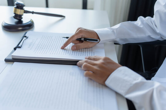 Lawyer sits on chair and reading documents, Justice process concept