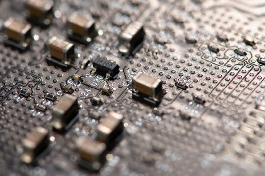 Circuit board with solder detail. Circuit board in smd surface. Circuit board for hardware electronics. Circuit board as close-up texture.