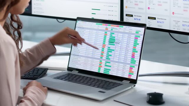 Financial Analyst Working On Year-end Reports Using Laptop