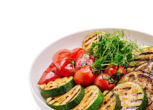 Grilled vegetables served in a white bowl for a healthy meal