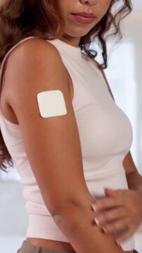 Young Woman Applies Contraceptive Patch On Arm