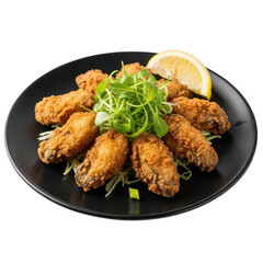 Fototapeta premium Crispy fried chicken wings garnished with fresh parsley on a black plate