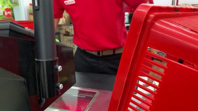 4K close-up of a cashier scanning products at a retail checkout counter in Jakarta, Indonesia. Suitable for shopping, supermarket, consumer, business and retail industry themes. June 10, 2026.