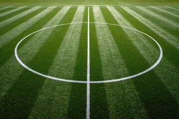 Obraz premium Close-up of a perfectly manicured soccer field center circle.