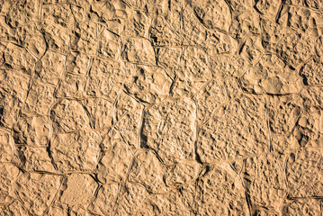 Naklejka premium Brown stoned wall as a texture, pattern, background