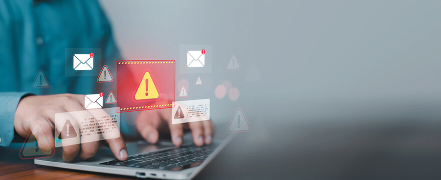 Cybersecurity email security alert concept featuring a professional using a laptop with warning notifications, phishing attack indicators, spam detection, malware protection, data breach prevention,