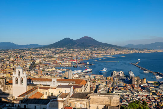 Italy, Campania, Naples, Certosa di San Martino museum and harbor in Gulf of Naples with Mount Vesuvius in background