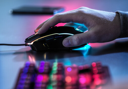 Boy using gaming mouse on table