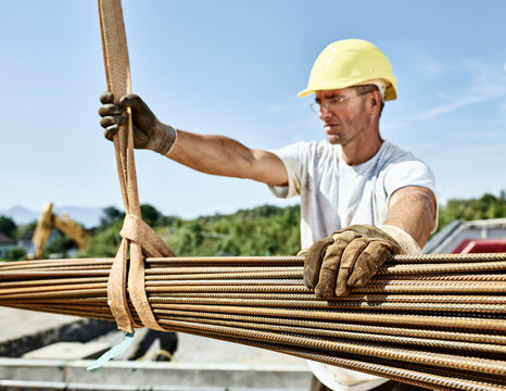 Construction worker with construction steel on construction site