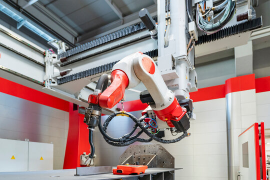 Automated industrial robotic arm in a modern manufacturing plant