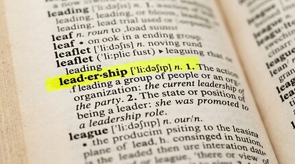 Obraz premium Leadership definition highlighted in dictionary macro shot for corporate management training