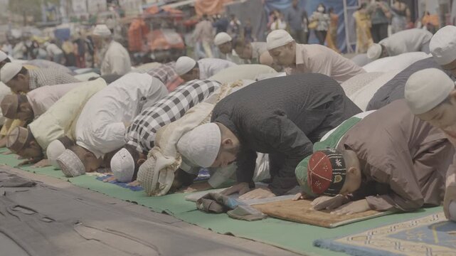 Muslim Men Offering Eid Namaz During Festival Celebration | Islamic Prayer Gathering, Faith, Devotion, Community Spirit and Religious Tradition