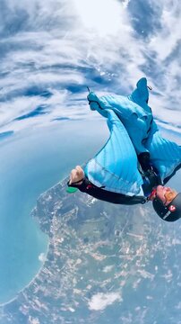 fun wingsuit fly in Thailand dropzone. Blue suit