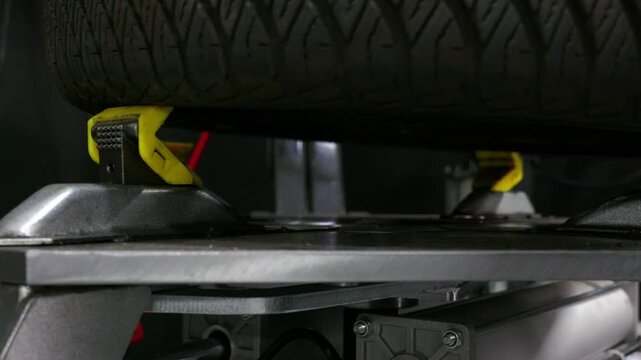 Tire Changer Removing Tire Bead from Rim Using Demounting Head Hooks