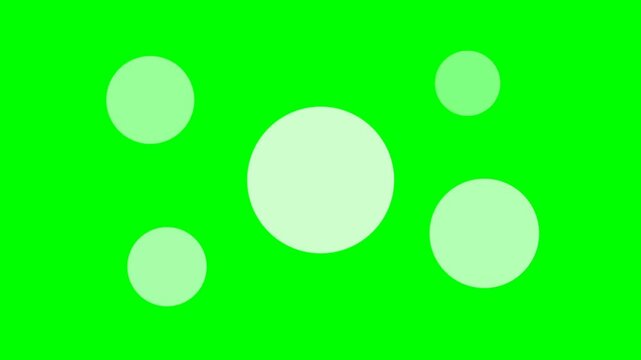 Green screen with white circles.