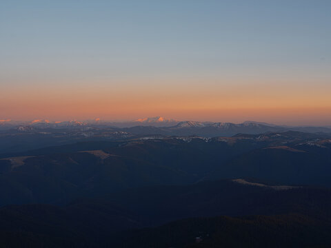 Golden sunset over snow-capped Carpathian peaks
